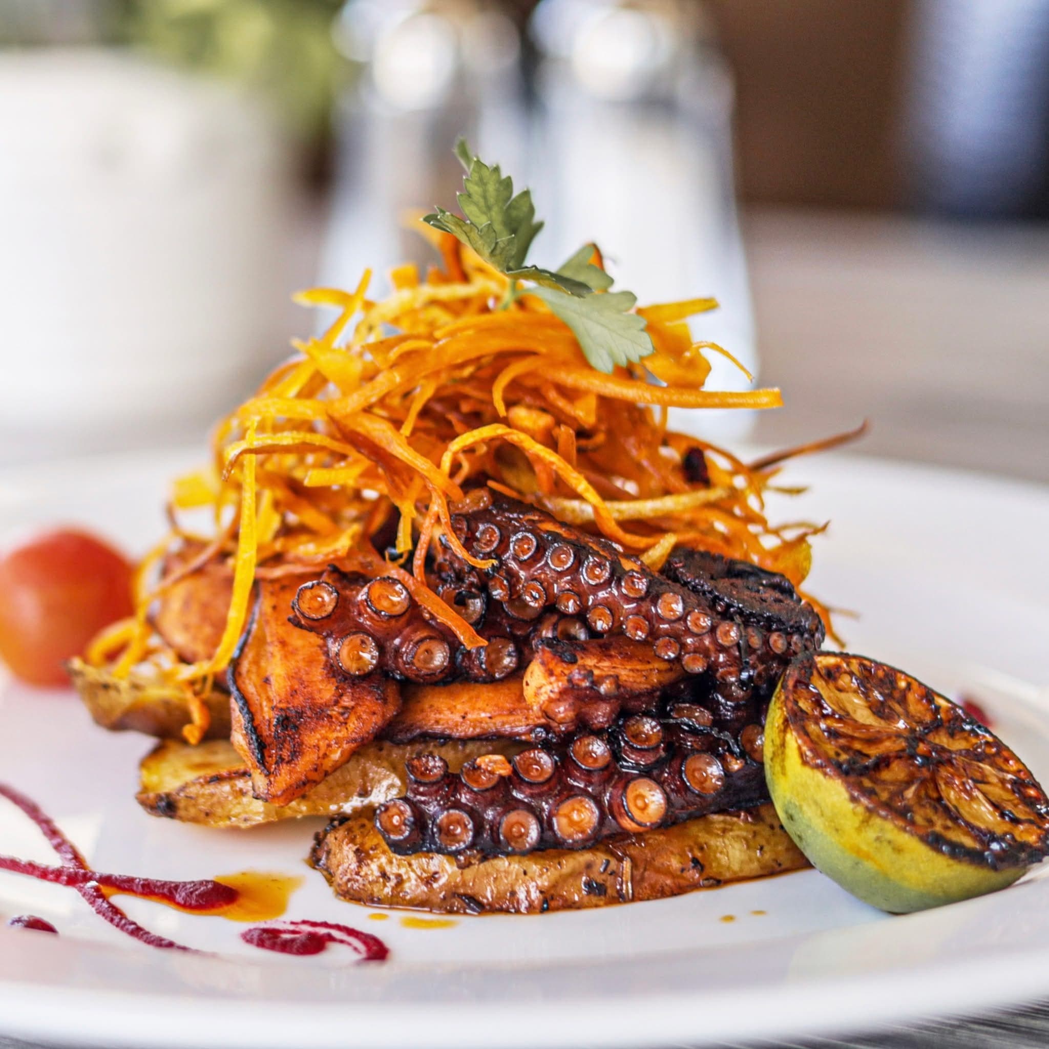 Colorful display of traditional Mexican dishes and seafood specialties from Cozumel